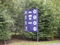 Large symbols on a dark blue sign.